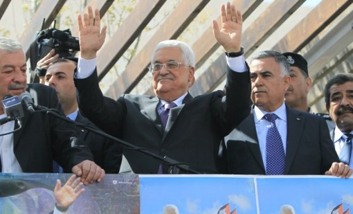 Palestinian Authority President Mahmoud Abbas waves to his supporters following his trip to Washington, DC, on Thursday, March 20, 2014, in the West Bank city of Ramallah (AFP/Abbas Nomani)
