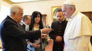 Pope Francis exchanges gifts with Palestinian Authority President Mahmoud Abbas during an audience at the Vatican Saturday, May 16, 2015.(Alberto Pizzoli/Pool Photo via AP)